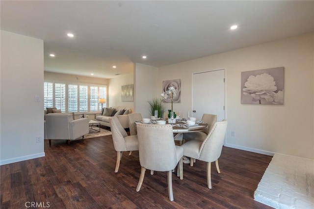 dining room with wood finished floors, baseboards, and recessed lighting