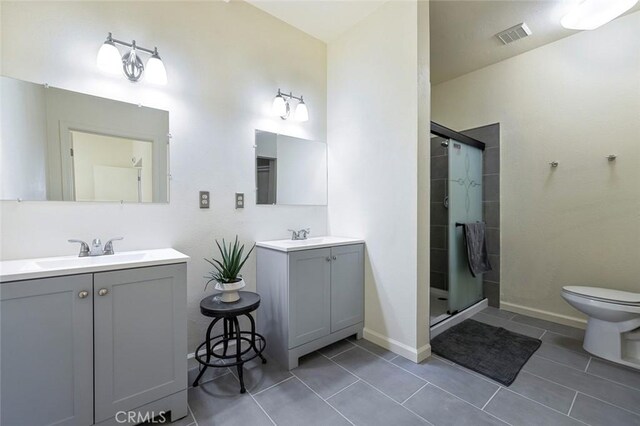 28951 Spring Valley Rd, Tollhouse, CA 93667 - bathroom featuring visible vents, two vanities, a stall shower, a sink, and tile patterned flooring