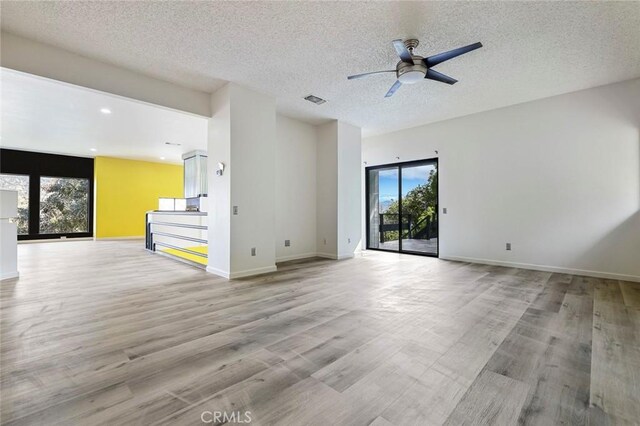 28951 Spring Valley Rd, Tollhouse, CA 93667 - unfurnished room featuring visible vents, baseboards, light wood-style floors, and a ceiling fan