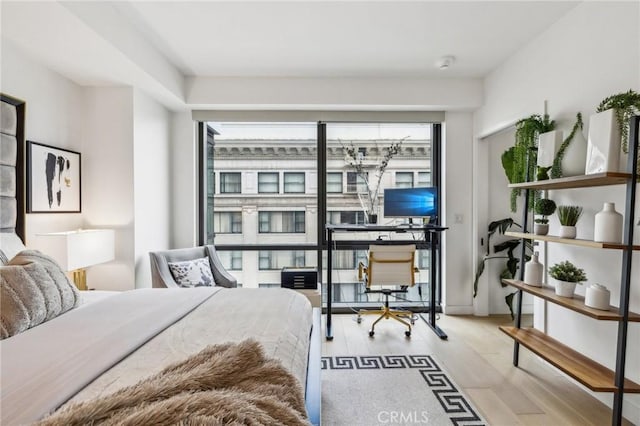 400 S Broadway Unit 1011, Los Angeles, CA 90013 - bedroom with wood finished floors and an office area