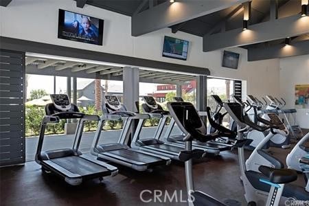 workout area with high vaulted ceiling