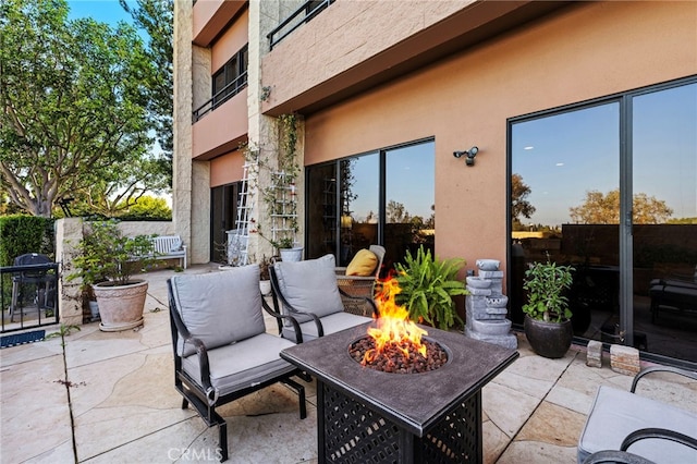 view of patio / terrace featuring area for grilling and a fire pit