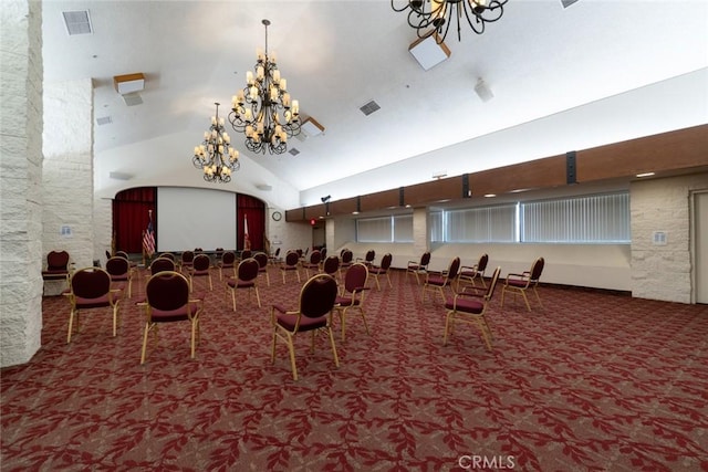misc room featuring carpet flooring, a notable chandelier, high vaulted ceiling, and visible vents