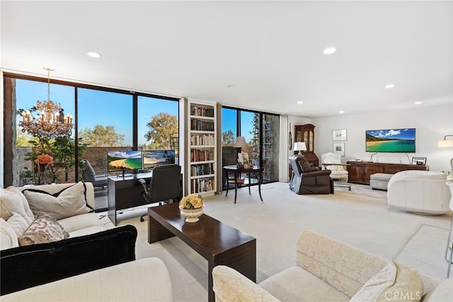 living room with light carpet, a wall of windows, recessed lighting, and a chandelier