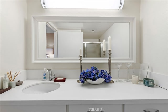 bathroom featuring vanity and a shower stall