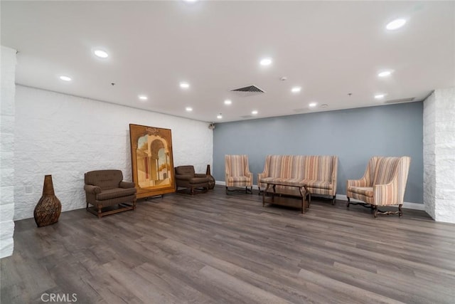 sitting room featuring baseboards, visible vents, wood finished floors, and recessed lighting