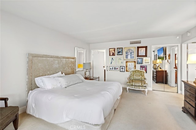 bedroom with light carpet, baseboards, and visible vents