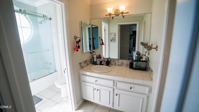 600 Monte Vista Dr, Santa Paula, CA 93060 - bathroom with vanity, enclosed tub / shower combo, decorative backsplash, tile patterned floors, and toilet