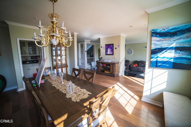 600 Monte Vista Dr, Santa Paula, CA 93060 - dining room featuring ornamental molding, baseboards, an inviting chandelier, and wood finished floors