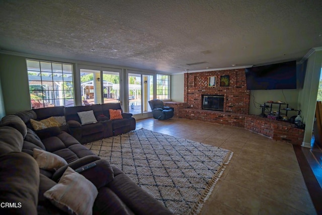 600 Monte Vista Dr, Santa Paula, CA 93060 - living room featuring a textured ceiling, ornamental molding, a fireplace, and tile patterned flooring
