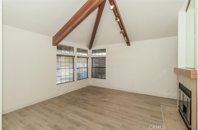 712 E Magill Ave, Fresno, CA 93710 - unfurnished living room featuring a fireplace with flush hearth and light wood-type flooring
