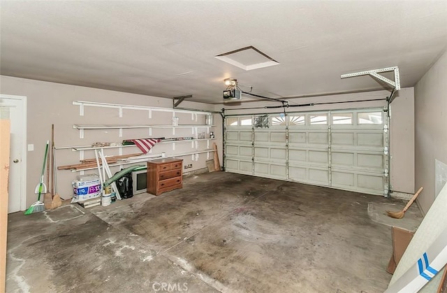 712 E Magill Ave, Fresno, CA 93710 - garage featuring a garage door opener