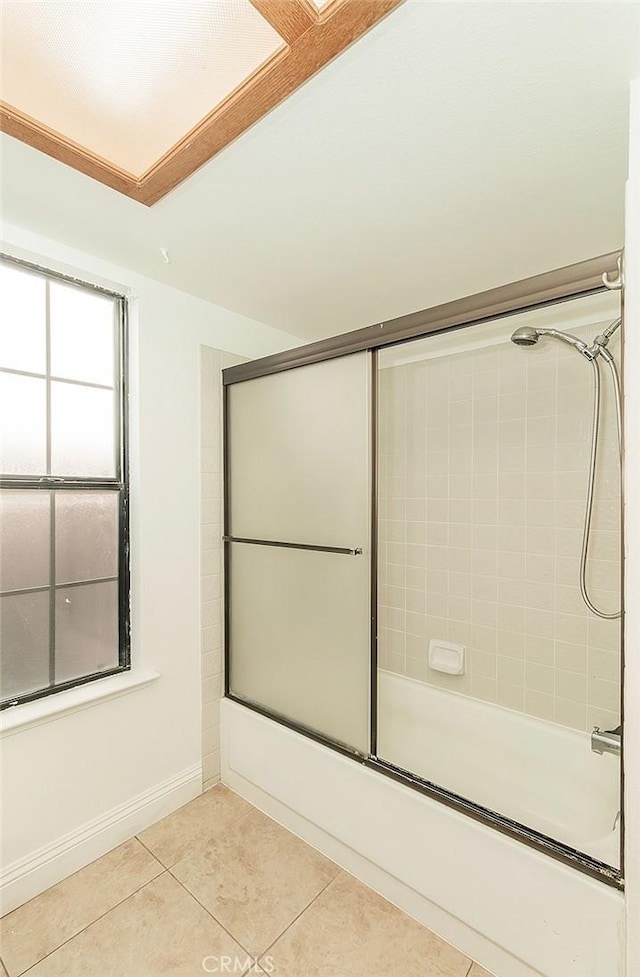 712 E Magill Ave, Fresno, CA 93710 - bathroom with enclosed tub / shower combo and tile patterned flooring