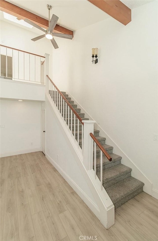 712 E Magill Ave, Fresno, CA 93710 - stairs with beam ceiling, wood finished floors, and ceiling fan