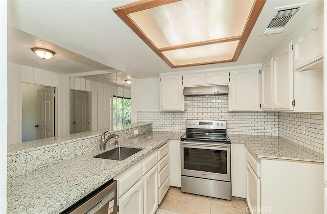 712 E Magill Ave, Fresno, CA 93710 - kitchen featuring stainless steel appliances, under cabinet range hood, white cabinets, and light tile patterned floors