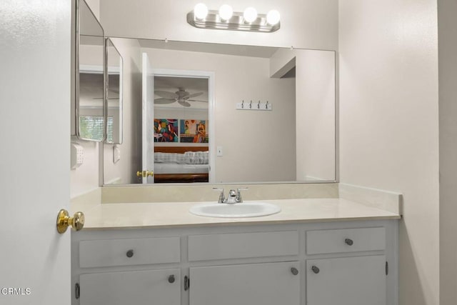 bathroom featuring vanity, ensuite bath, and a ceiling fan