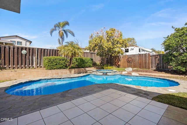 view of pool with a patio, a pool with connected hot tub, and a fenced backyard