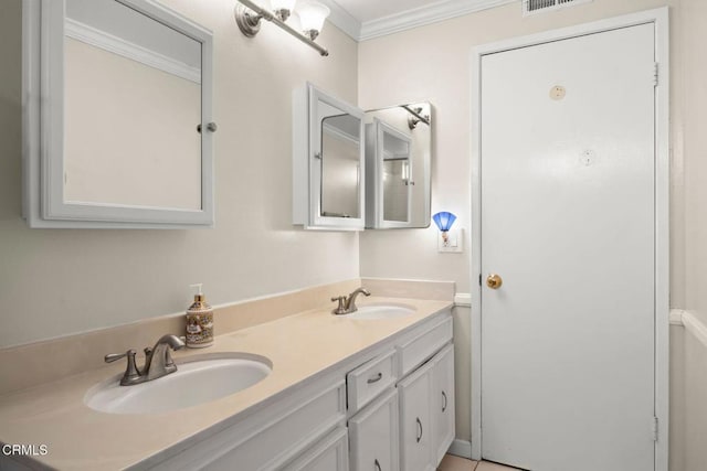 full bathroom featuring double vanity, visible vents, crown molding, and a sink