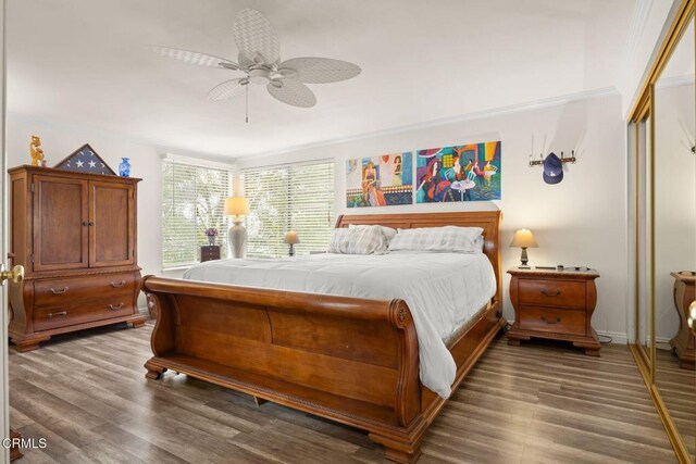 bedroom featuring a closet, a ceiling fan, and wood finished floors