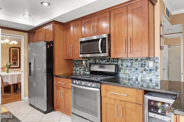kitchen featuring dark stone countertops, stainless steel appliances, wine cooler, crown molding, and light tile patterned floors