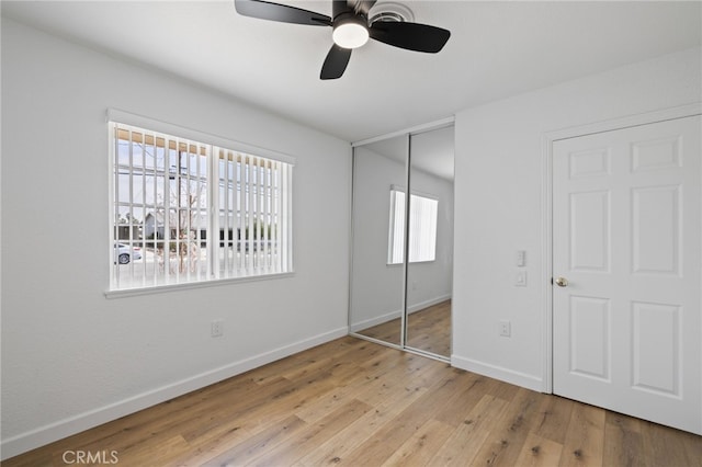 43415 Illinois Ave, Palm Desert, CA 92211 - unfurnished bedroom with a closet, baseboards, hardwood / wood-style flooring, and ceiling fan