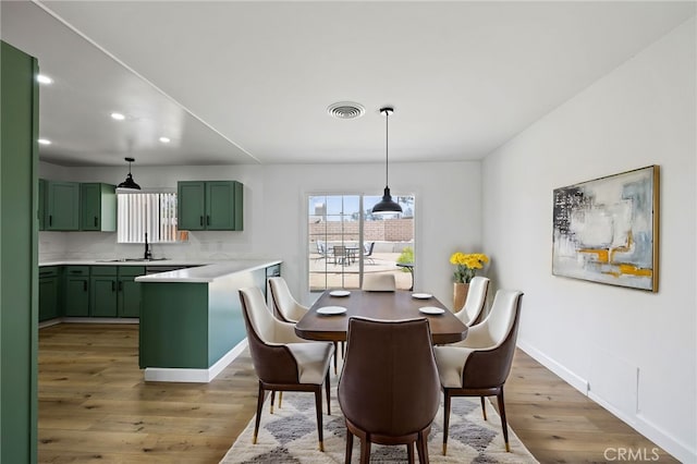43415 Illinois Ave, Palm Desert, CA 92211 - dining room with recessed lighting, light wood finished floors, and baseboards