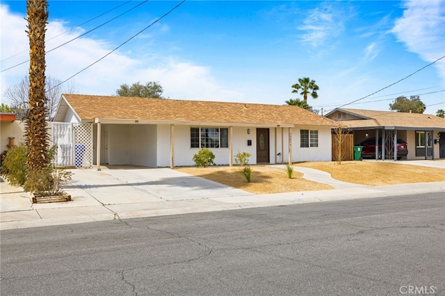 43415 Illinois Ave, Palm Desert, CA 92211 - ranch-style home with an attached carport, driveway, and stucco siding