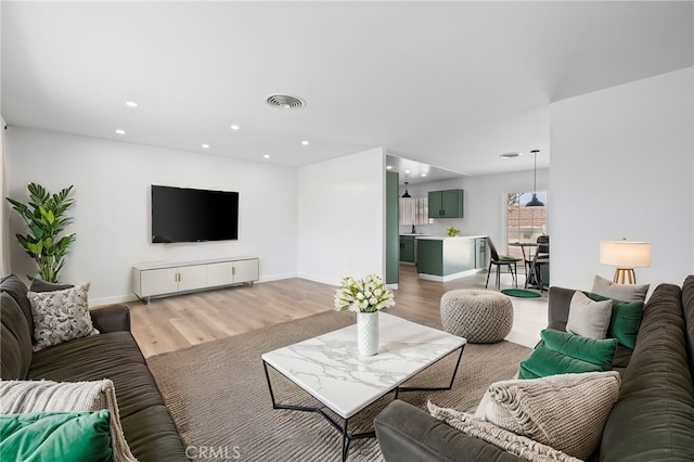43415 Illinois Ave, Palm Desert, CA 92211 - living area featuring recessed lighting, light wood-type flooring, and baseboards