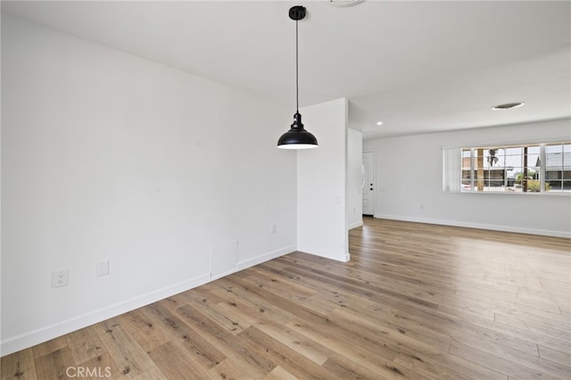 43415 Illinois Ave, Palm Desert, CA 92211 - unfurnished living room with wood-type flooring, baseboards, and recessed lighting