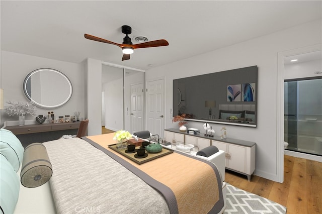 43415 Illinois Ave, Palm Desert, CA 92211 - bedroom with light wood-style floors, connected bathroom, ceiling fan, and baseboards
