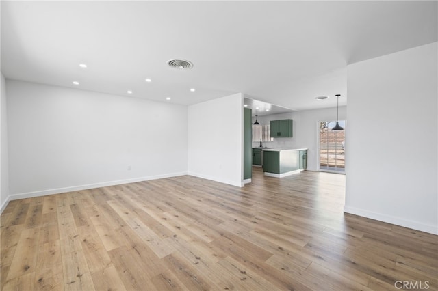 43415 Illinois Ave, Palm Desert, CA 92211 - unfurnished living room with recessed lighting, light wood-type flooring, and baseboards