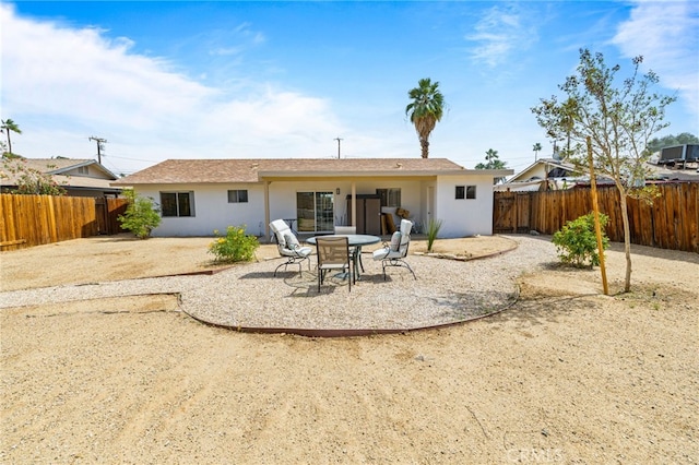 43415 Illinois Ave, Palm Desert, CA 92211 - rear view of property featuring a patio area, a fenced backyard, and stucco siding