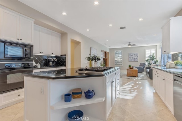kitchen featuring decorative backsplash, visible vents, dark countertops, open shelves, and black appliances