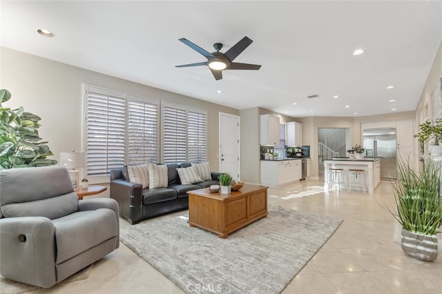 living room featuring recessed lighting, ceiling fan, light tile patterned floors, and visible vents