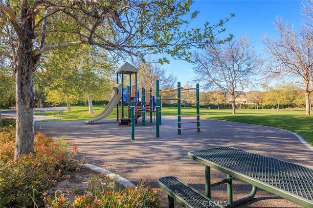 community play area with a lawn