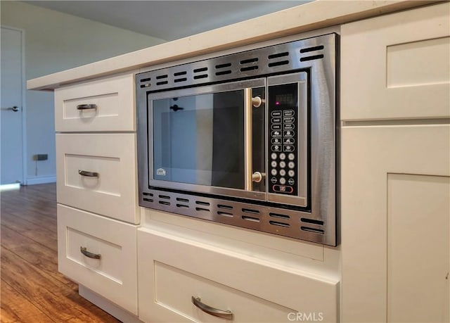24055 Paseo Del Lago W Unit 1455, Laguna Woods, CA 92637 - details with stainless steel microwave and wood finished floors