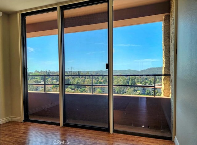24055 Paseo Del Lago W Unit 1455, Laguna Woods, CA 92637 - interior space featuring baseboards, wood finished floors, and a mountain view
