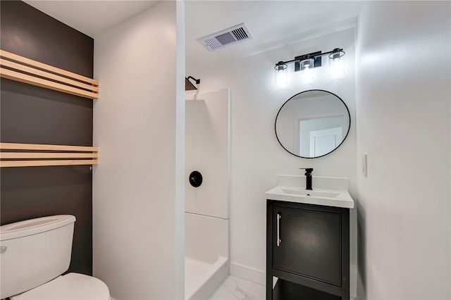 bathroom with vanity, marble finish floor, walk in shower, toilet, and visible vents