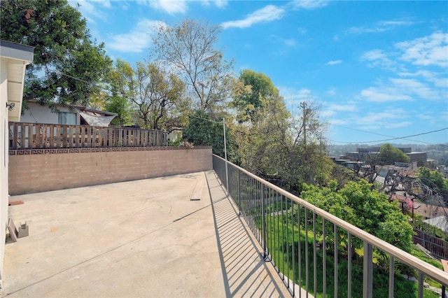 view of patio featuring a balcony