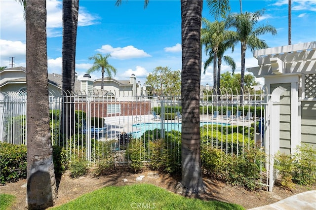 view of gate with fence