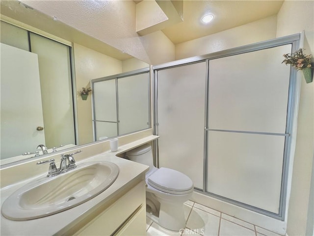 bathroom featuring an enclosed shower, tile patterned flooring, vanity, toilet, and recessed lighting