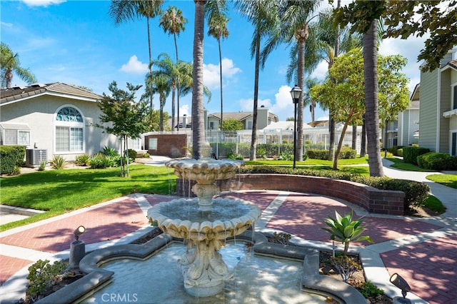 view of home's community featuring a lawn and a residential view