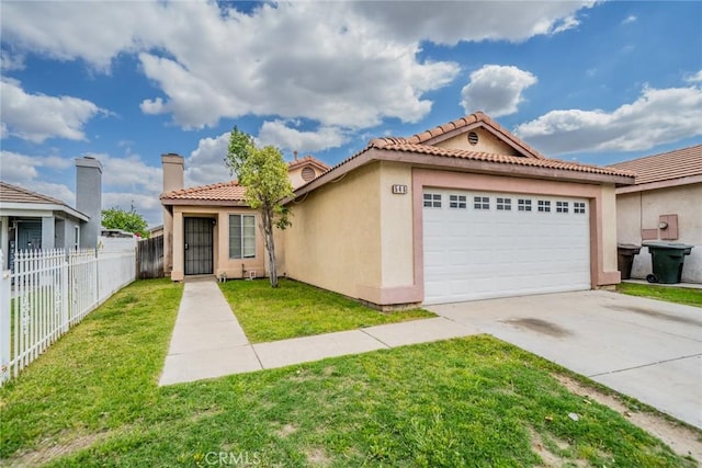 mediterranean / spanish house featuring an attached garage, stucco siding, fence, and a front lawn