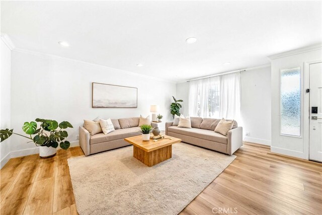 22287 Modina, Laguna Hills, CA 92653 - living room featuring crown molding, baseboards, plenty of natural light, light wood-style floors, and recessed lighting