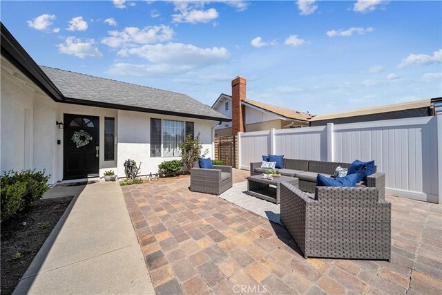 22287 Modina, Laguna Hills, CA 92653 - view of patio / terrace featuring an outdoor living space and a fenced backyard