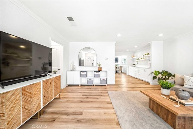 22287 Modina, Laguna Hills, CA 92653 - living area with crown molding, light wood-style flooring, and recessed lighting