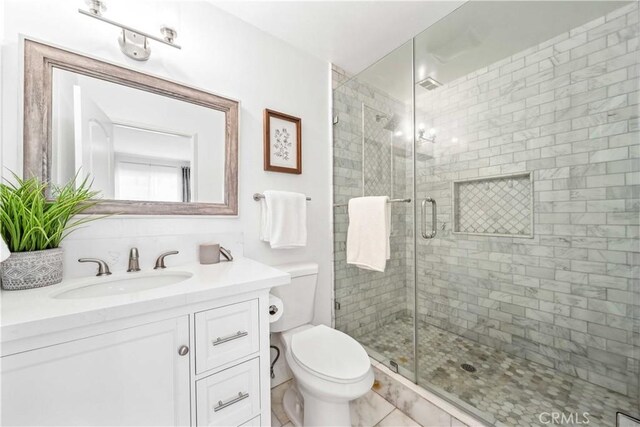 22287 Modina, Laguna Hills, CA 92653 - bathroom with a shower stall, vanity, and toilet