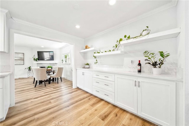 22287 Modina, Laguna Hills, CA 92653 - bar area with crown molding, light wood-type flooring, and recessed lighting