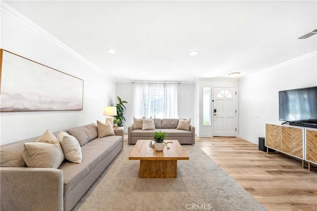 22287 Modina, Laguna Hills, CA 92653 - living room with crown molding, light wood finished floors, baseboards, and recessed lighting