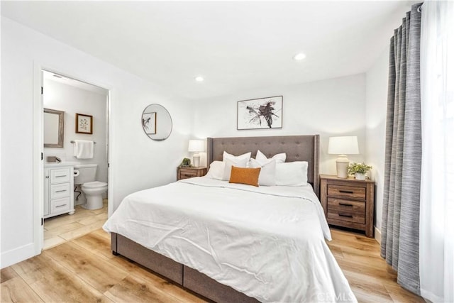 22287 Modina, Laguna Hills, CA 92653 - bedroom featuring light wood-style flooring, ensuite bathroom, recessed lighting, and baseboards